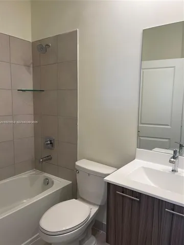 a bathroom with a sink a toilet and a bathtub