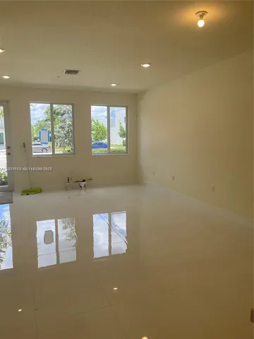 a view of an empty room with a window
