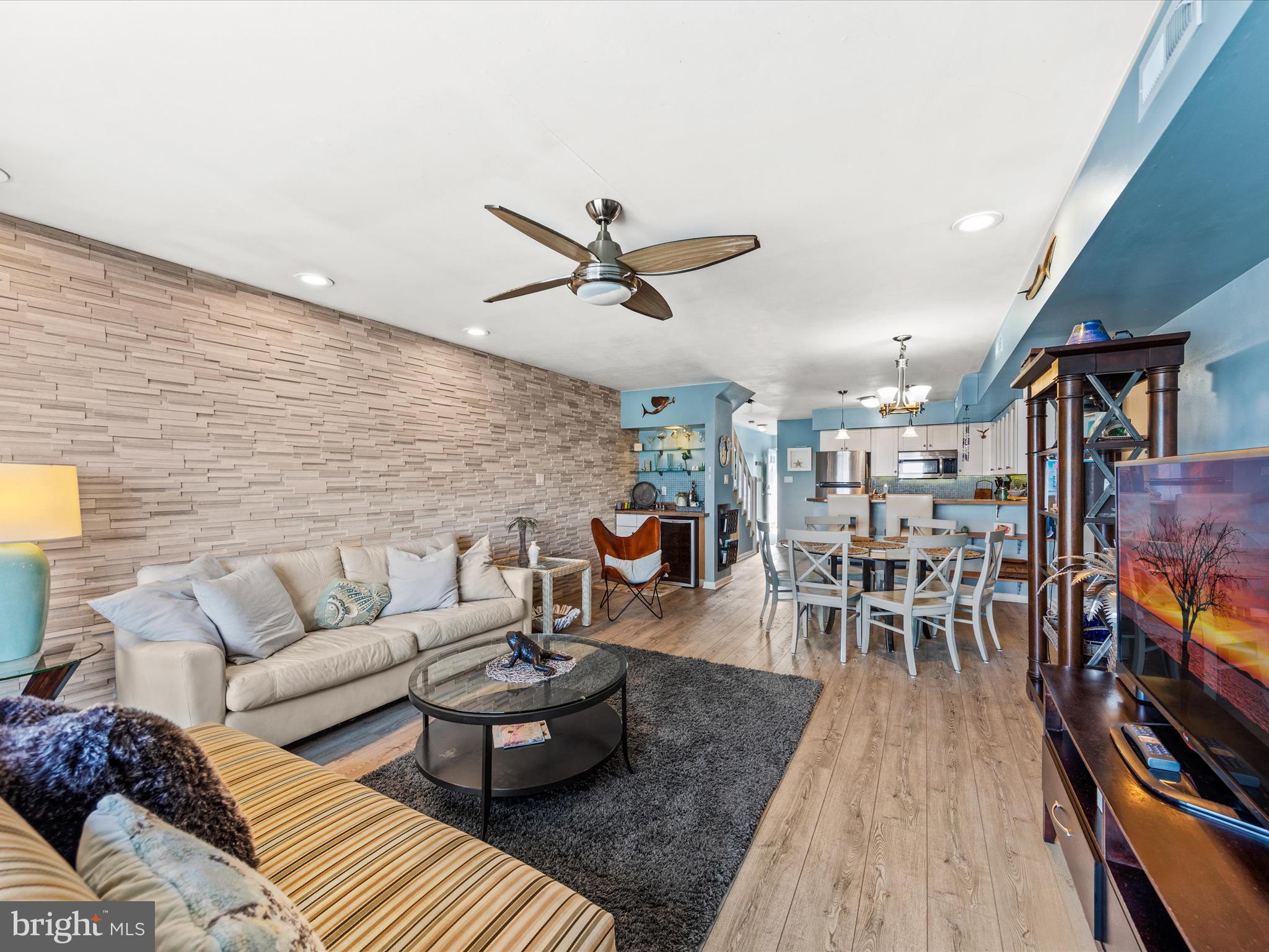 721 Rusty Anchor Road, Unit 22 Ocean City, MD 21842 - Photo 11 of 31 Living room with fireplace and wet bar