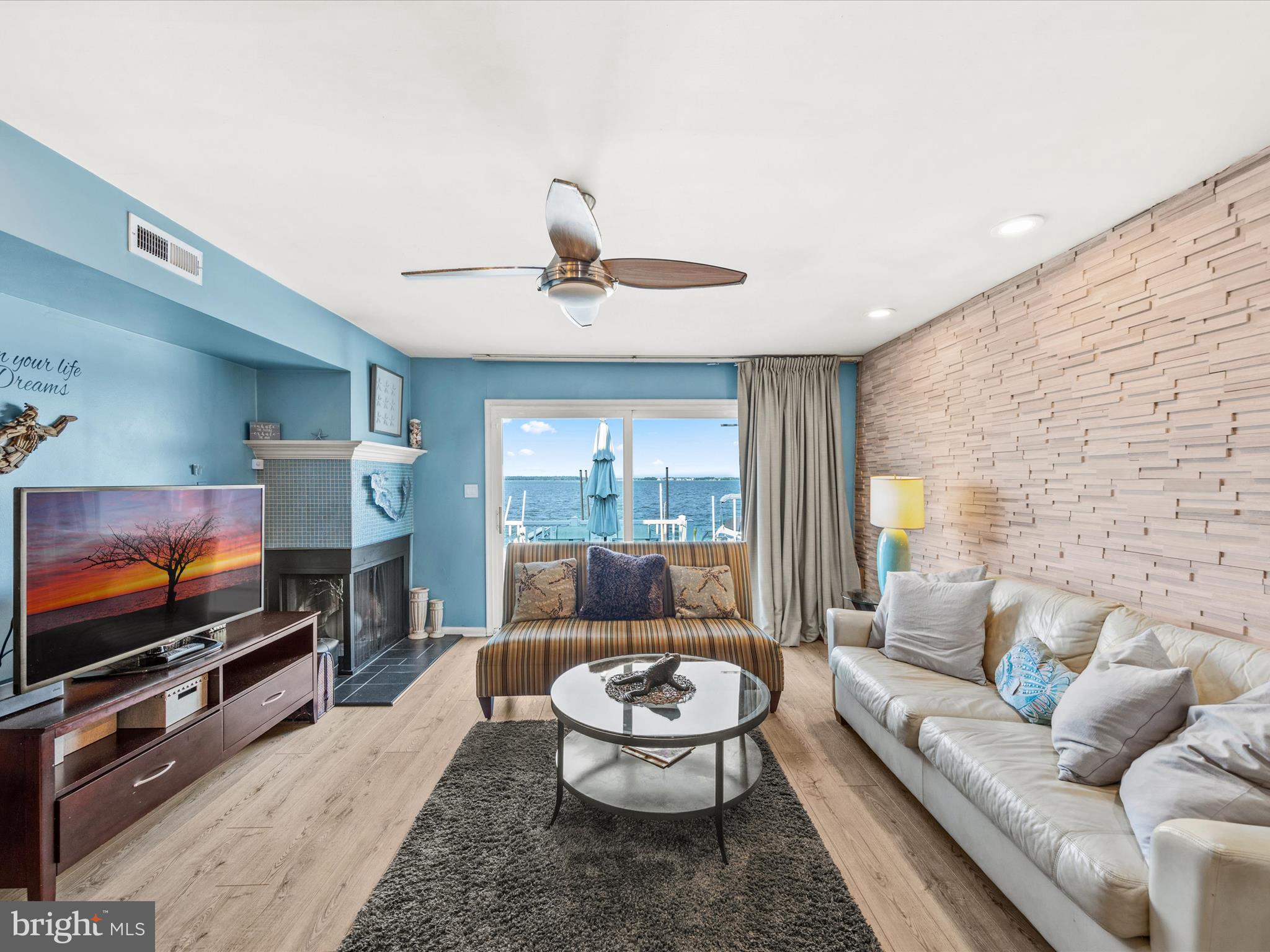 721 Rusty Anchor Road, Unit 22 Ocean City, MD 21842 - Photo 13 of 31 Living room with fireplace and wet bar