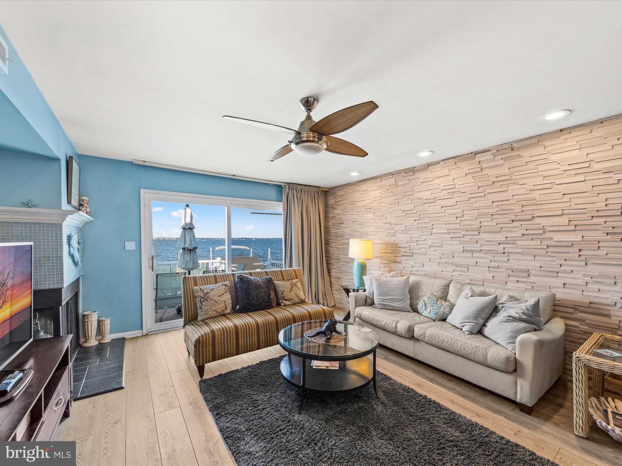 721 Rusty Anchor Road, Unit 22 Ocean City, MD 21842 - Photo 14 of 31 Living room with fireplace and wet bar