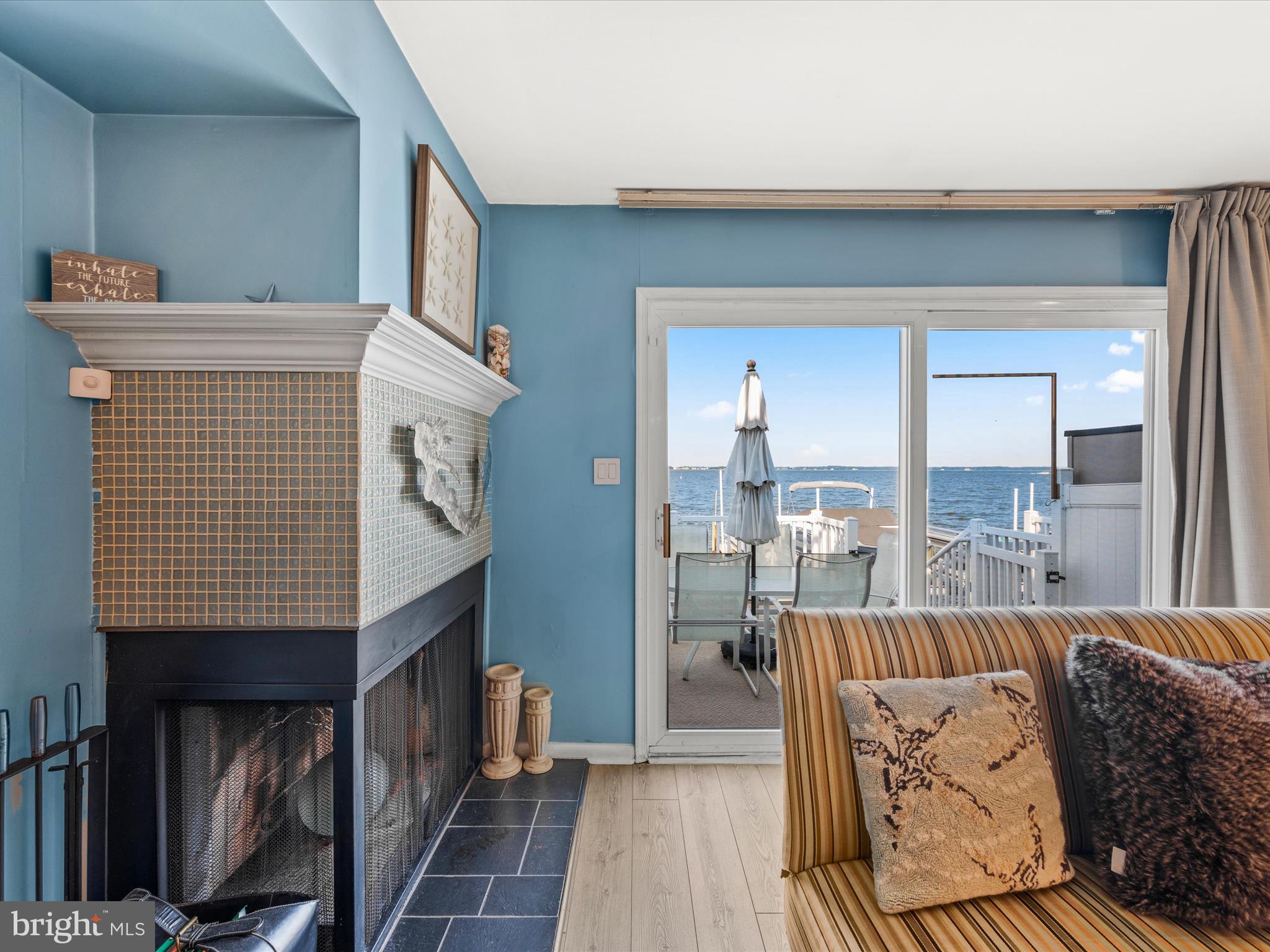 721 Rusty Anchor Road, Unit 22 Ocean City, MD 21842 - Photo 15 of 31 Living room with fireplace and wet bar