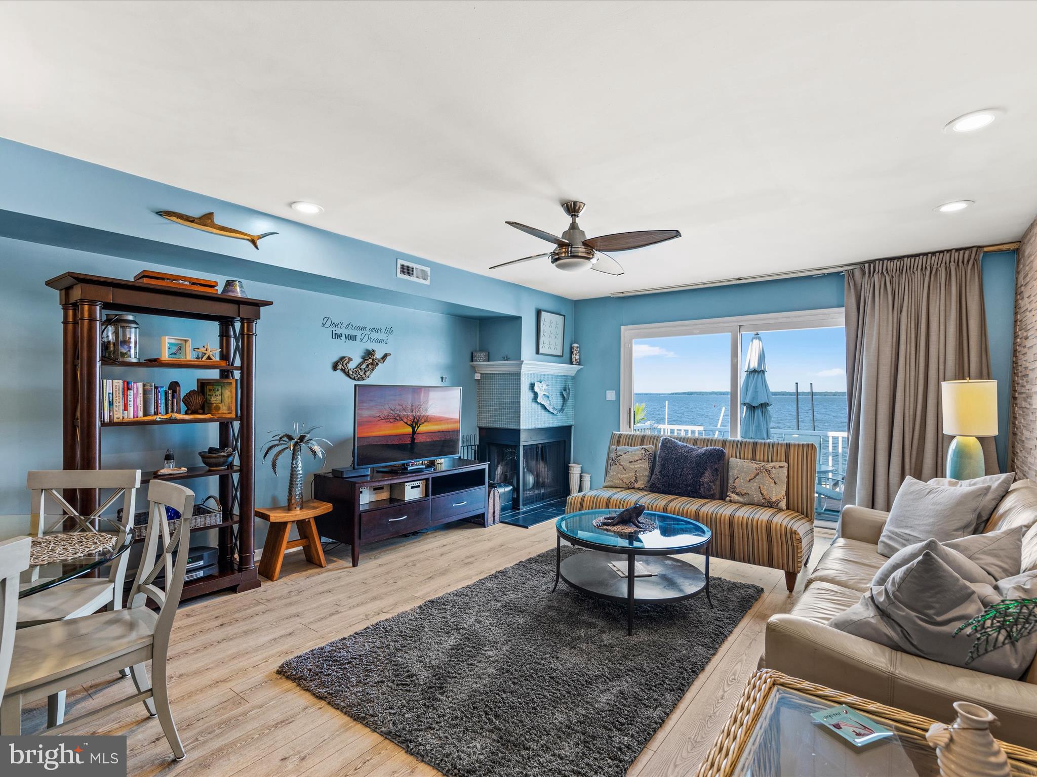 721 Rusty Anchor Road, Unit 22 Ocean City, MD 21842 - Photo 9 of 31 Living room with fireplace and wet bar