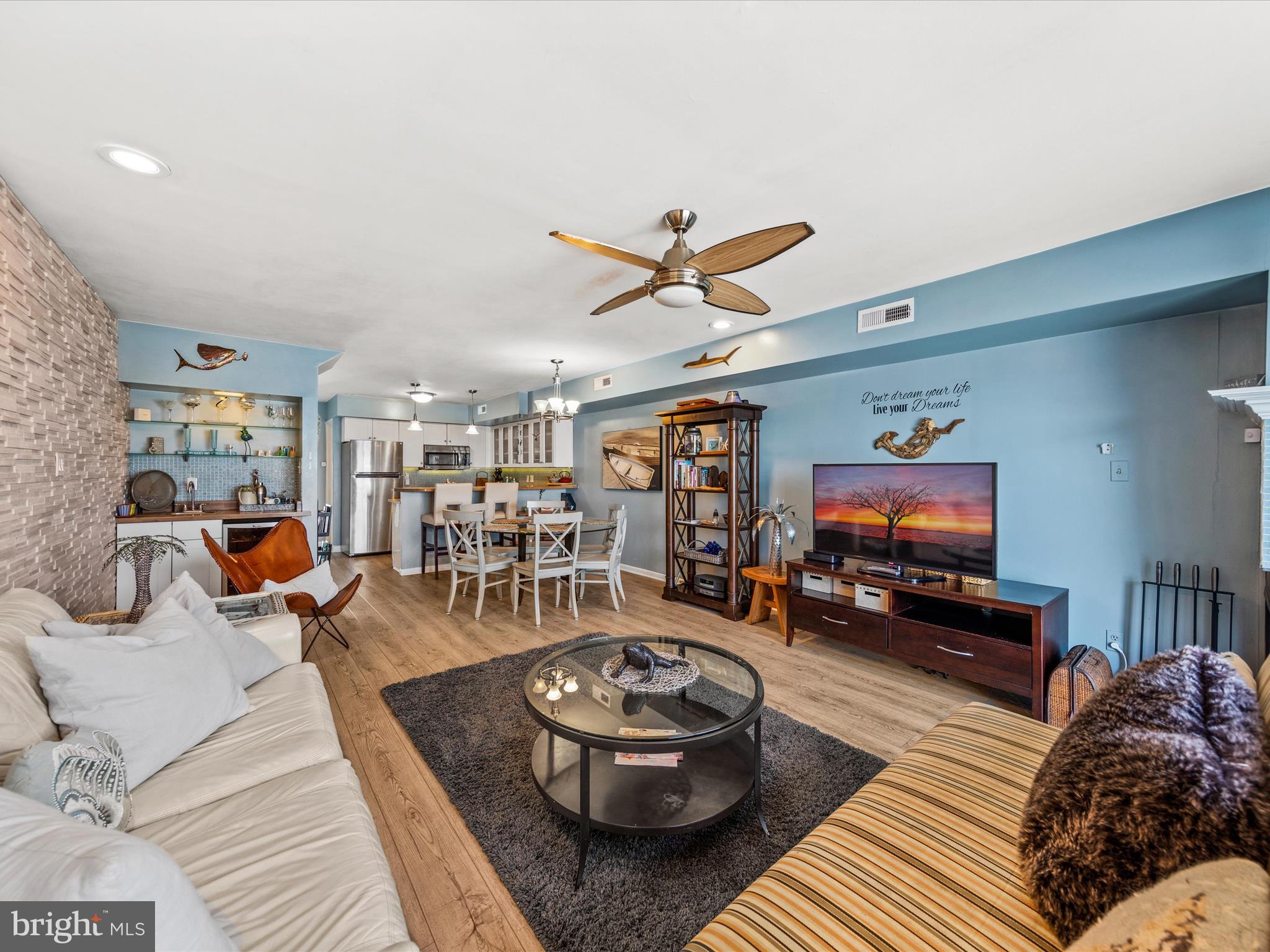 721 Rusty Anchor Road, Unit 22 Ocean City, MD 21842 - Photo 10 of 31 Living room with fireplace and wet bar