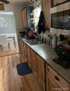 a kitchen with sink and cabinets