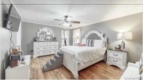 a bedroom with a bed and a dresser