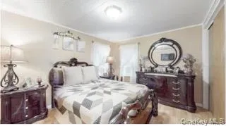 a bedroom with a bed and a closet in it