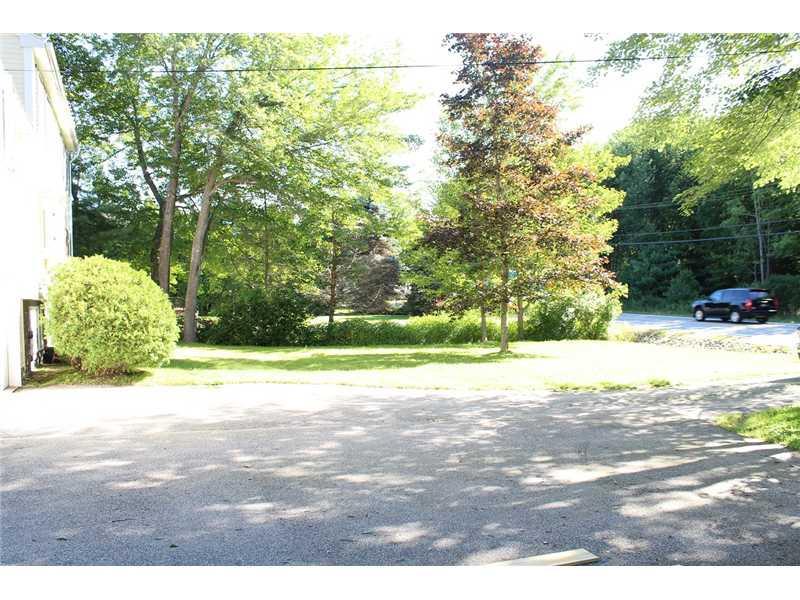 26 Guinea Road Biddeford, ME 04005 - Photo 27 of 32 Parking Lot/Garage. Front yard with...