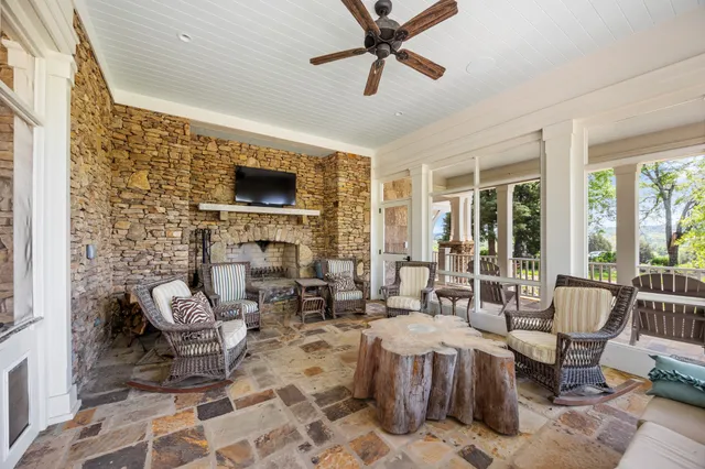 an aerial view of a house with a yard and lake view