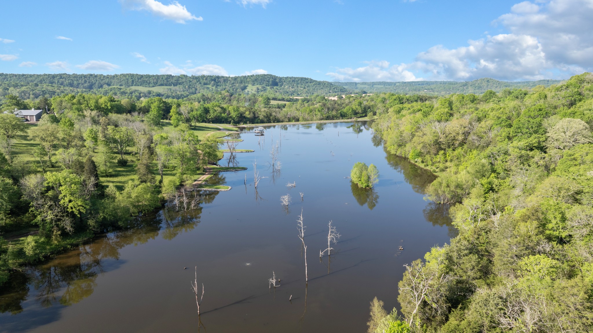 605 Red Oak Road Petersburg, TN 37144 - Photo 37 of 98 a view of a lake with a mountain in the background