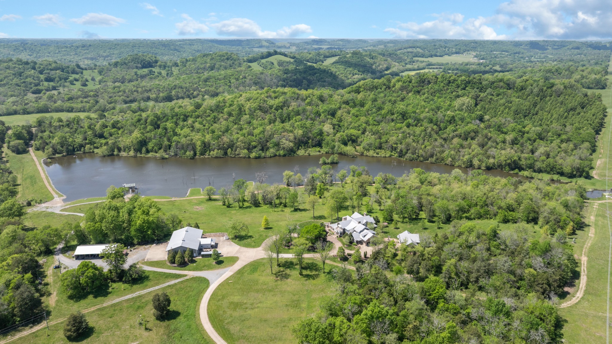 605 Red Oak Road Petersburg, TN 37144 - Photo 56 of 98 an aerial view of a house with a yard and lake view