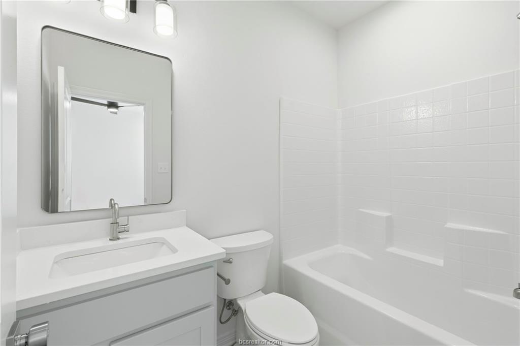 307 Sterling Street, Unit D College Station, TX 77840 - Photo 11 of 18 a bathroom with a sink toilet and bathtub
