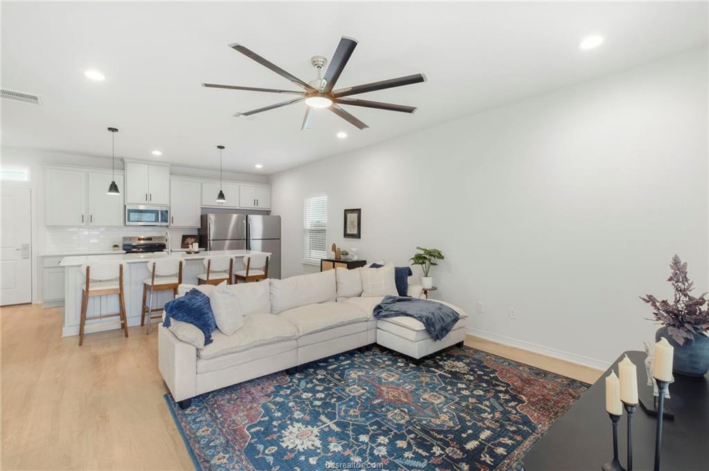 307 Sterling Street, Unit D College Station, TX 77840 - Photo 2 of 18 a living room with furniture and a rug