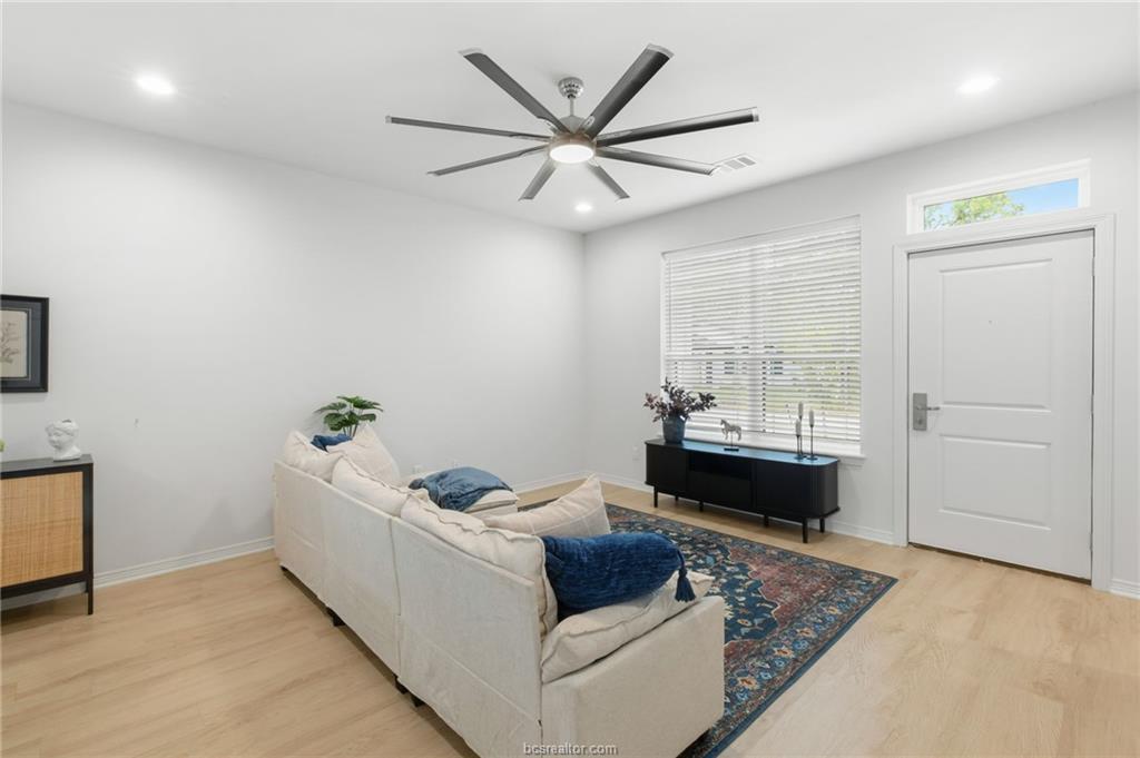 307 Sterling Street, Unit D College Station, TX 77840 - Photo 3 of 18 a living room with furniture and window