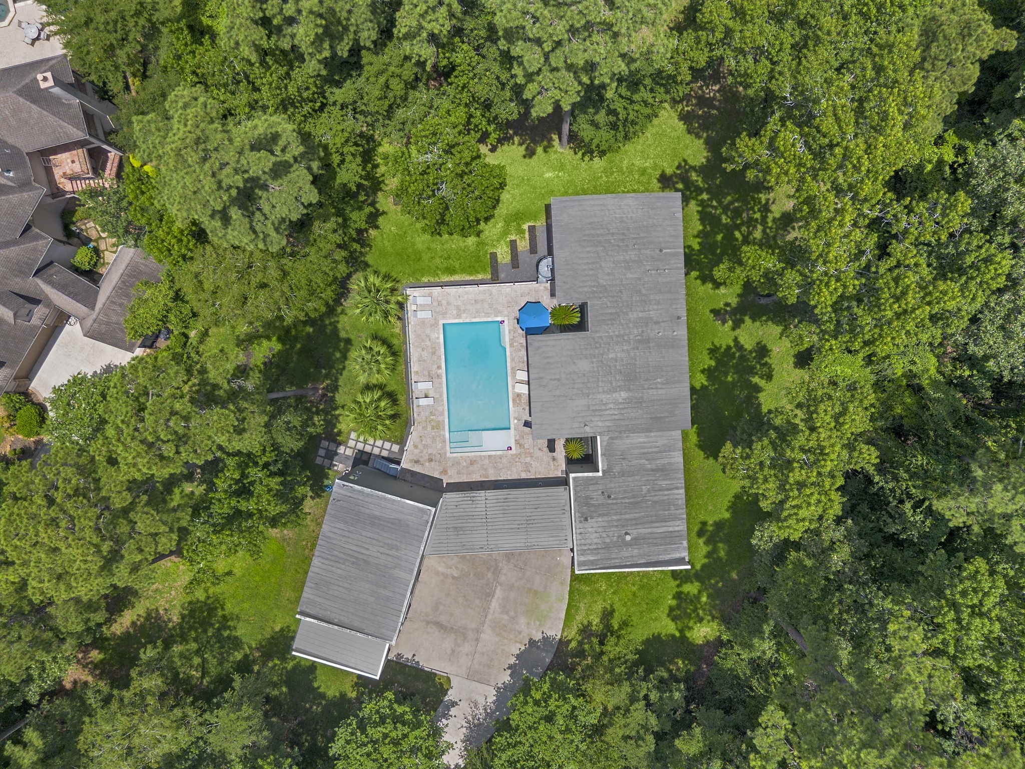 118 Angel Leaf Road The Woodlands, TX 77380 - Photo 42 of 50 Bird’s-eye view of home, pool, and tree-filled lot.