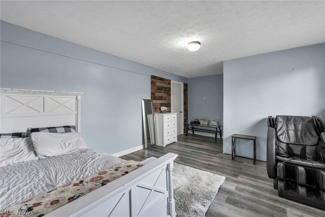 54 Park Road Painesville, OH 44077 - Photo 22 of 38 Bedroom with a textured ceiling and wood finished floors