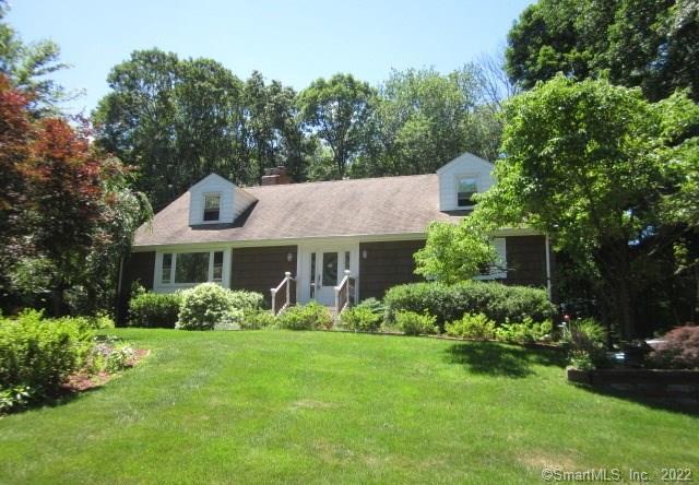 28 Mulberry Road Woodbridge, CT 06525 - Photo 1 of 1 a front view of a house with a garden