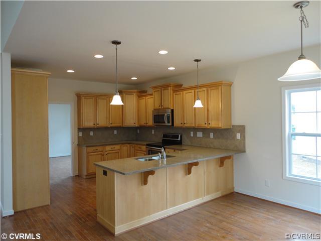 15712 Longlands Road Chesterfield, VA 23832 - Photo 4 of 12 Kitchen - Granite Countertops, tile backsplash, re