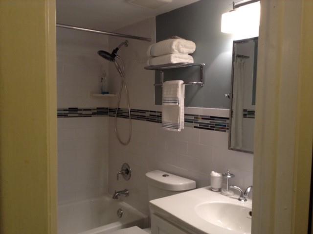 3199 Foxcroft Road, Unit 308 Miramar, FL 33025 - Photo 2 of 9 a bathroom with a sink a toilet and shower