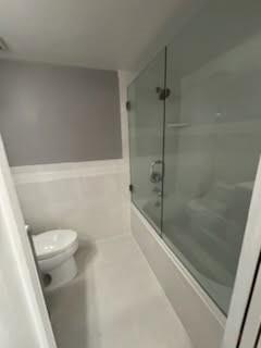 3199 Foxcroft Road, Unit 308 Miramar, FL 33025 - Photo 8 of 9 a bathroom with a shower and toilet