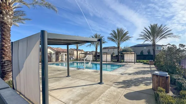 a view of a house with backyard and porch
