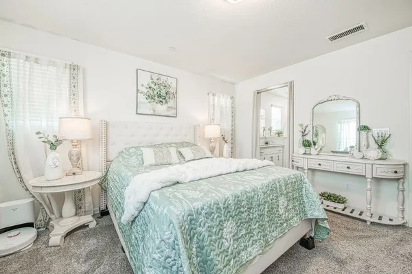 a bathroom with a sink a toilet and a shower