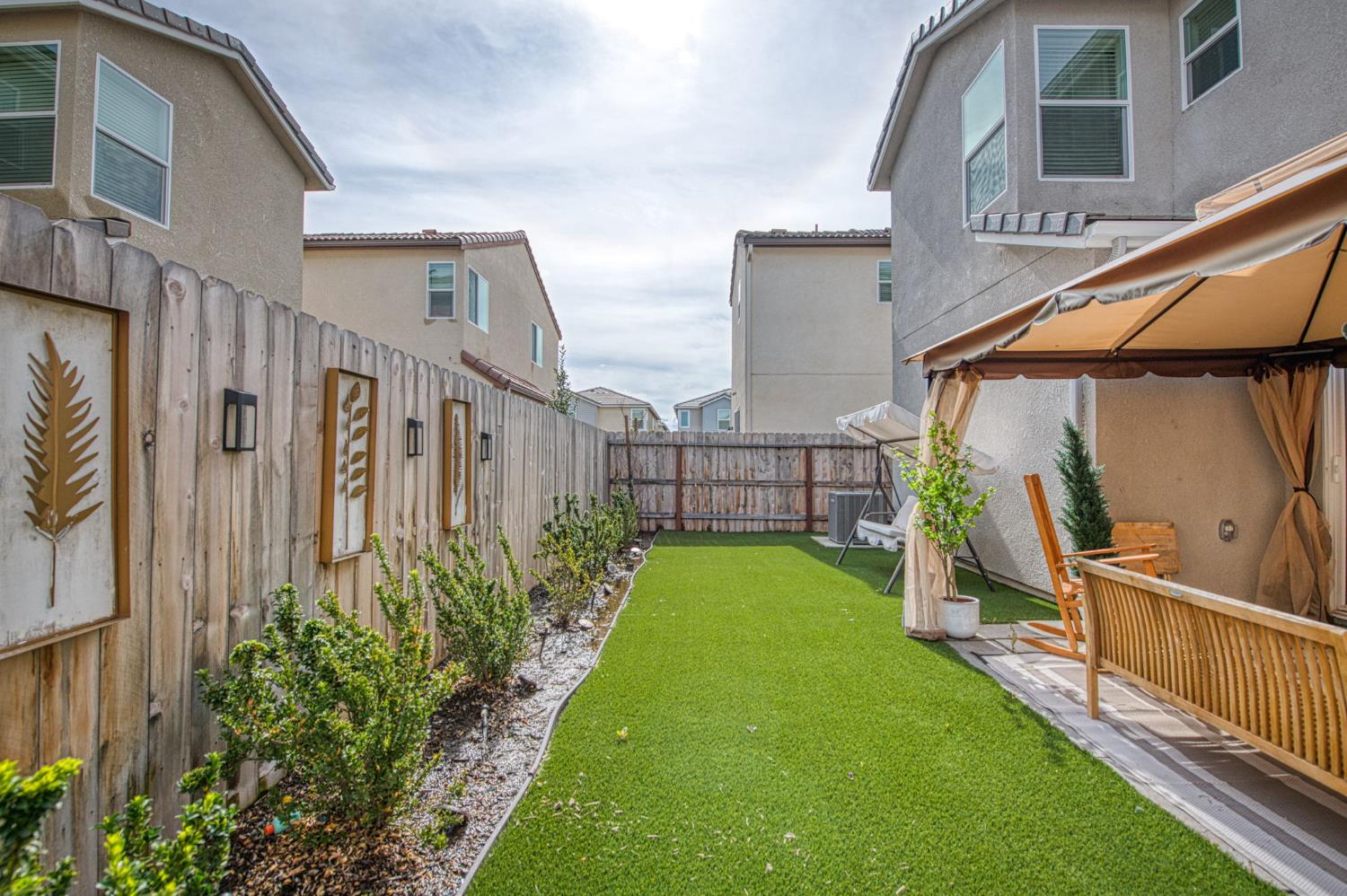 2053 North Ralph Lane Clovis, CA 93619 - Photo 28 of 31 a view of backyard with barbeque grill and potted plants