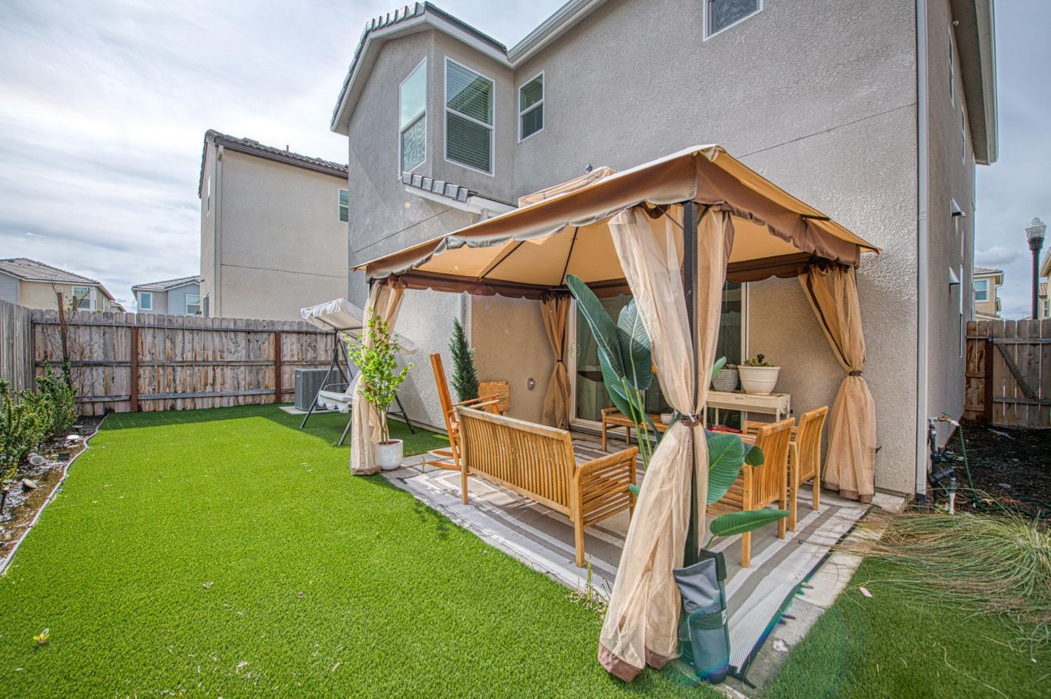 2053 North Ralph Lane Clovis, CA 93619 - Photo 29 of 31 a view of an house with backyard and deck