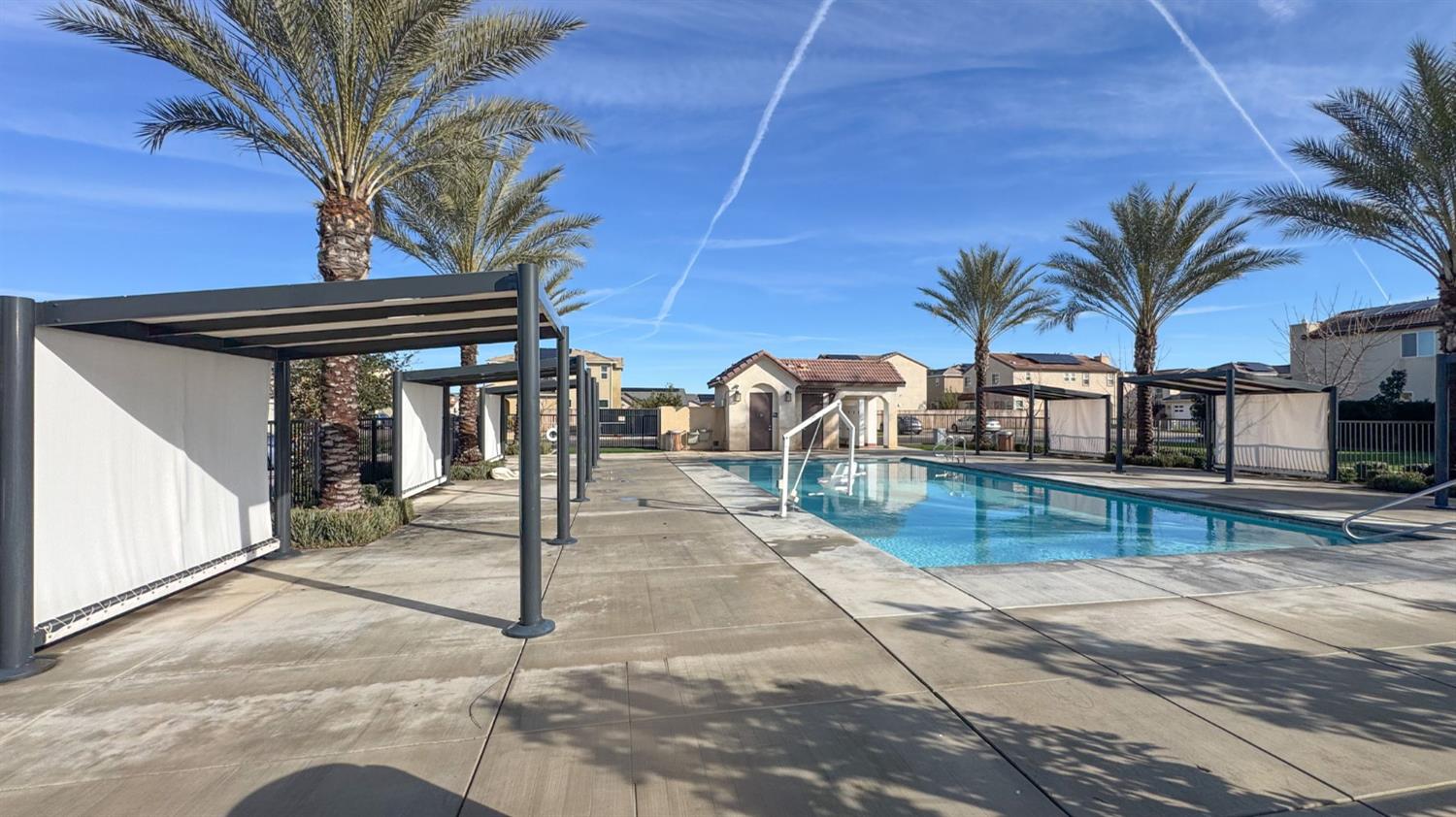 2053 North Ralph Lane Clovis, CA 93619 - Photo 3 of 31 a view of a backyard patio and swimming pool