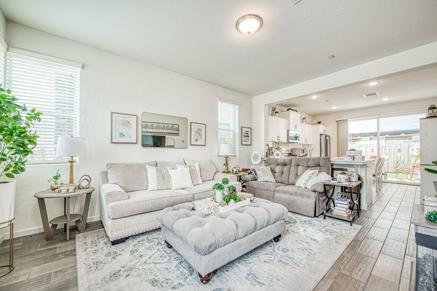 2053 North Ralph Lane Clovis, CA 93619 - Photo 7 of 31 a living room with furniture and a large window