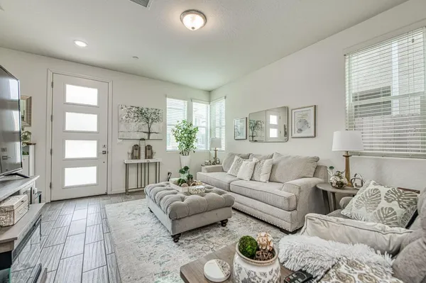 a living room with furniture and a table
