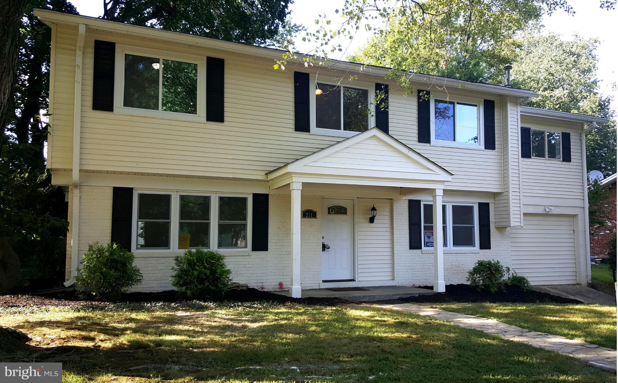 a view of a yard in front of a house