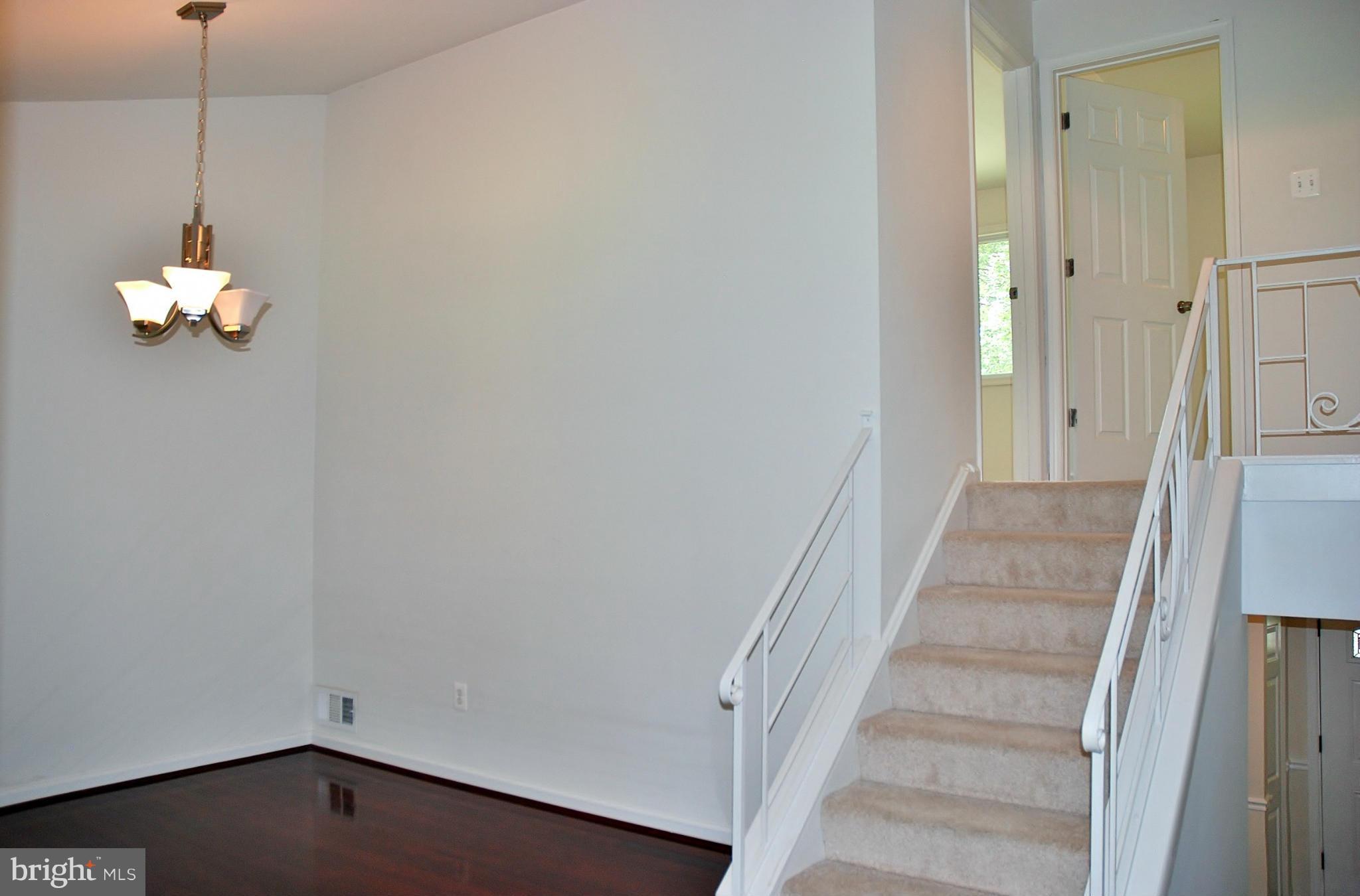 211 Thistle Drive Silver Spring, MD 20901 - Photo 6 of 23 a view of a hallway with a chandelier