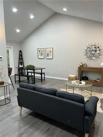 a living room with furniture and a table