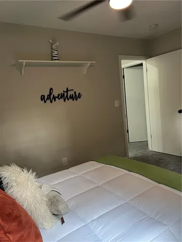 a bathroom with a sink toilet and a mirror