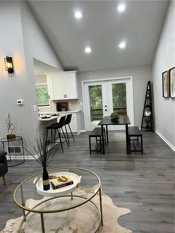 a living room with furniture rug and window