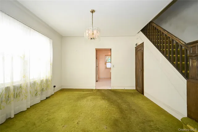 a view of an empty room with windows