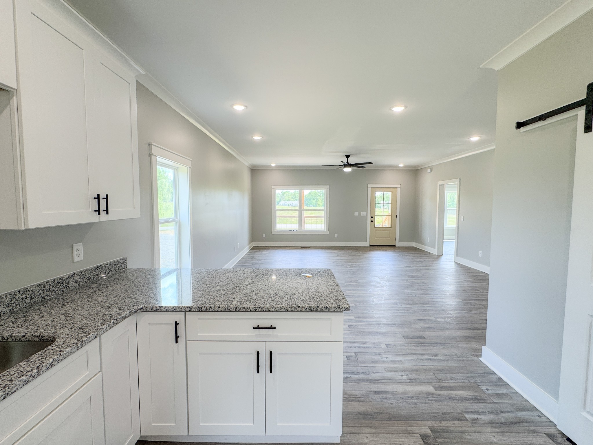 181 Rock House Hollow Road Bethpage, TN 37022 - Photo 23 of 51 a view of kitchen and hall with wooden floor