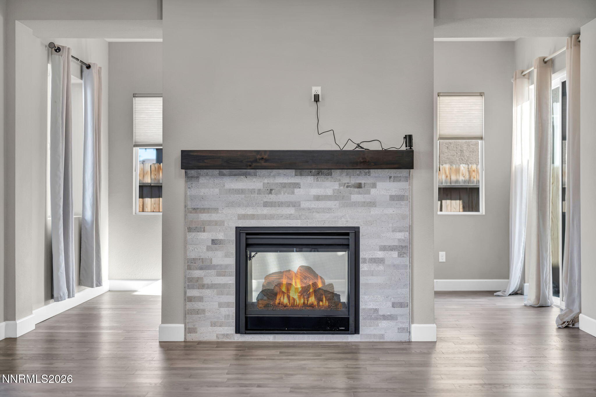 9267 Blue Basin Trail Reno, NV 89521 - Photo 14 of 95 a living room with furniture and a fireplace