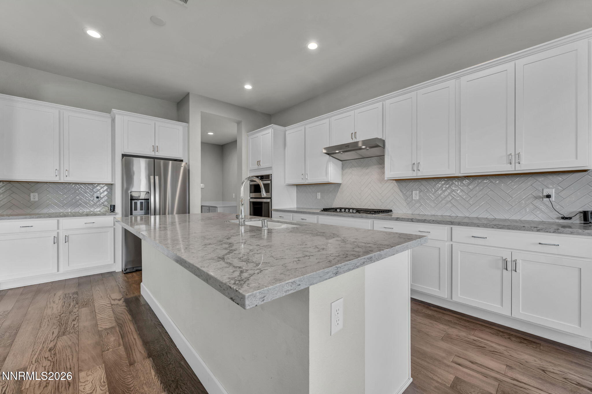 9267 Blue Basin Trail Reno, NV 89521 - Photo 21 of 95 a kitchen with stainless steel appliances granite countertop a sink stove and refrigerator