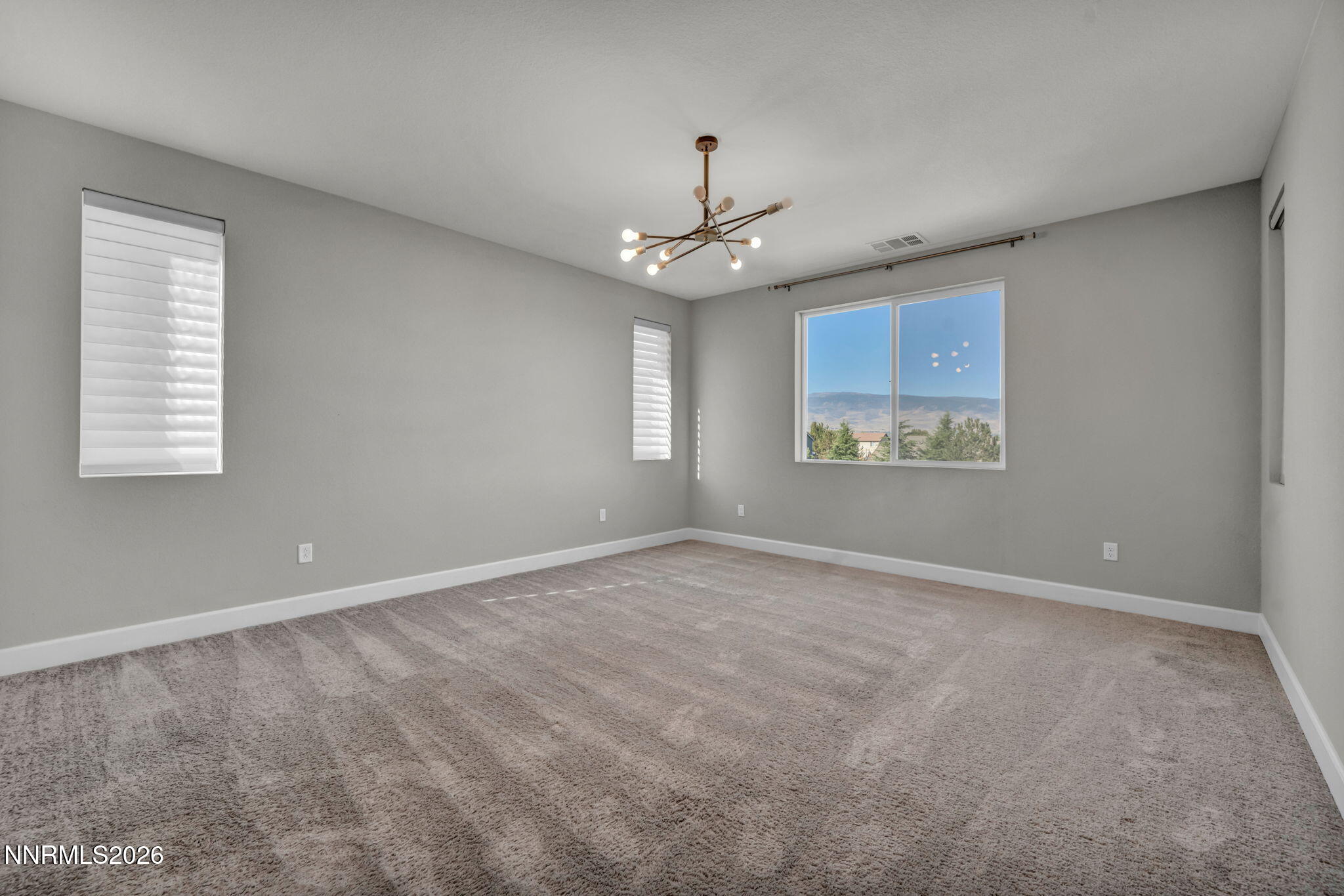 9267 Blue Basin Trail Reno, NV 89521 - Photo 36 of 95 a view of an empty room with a window