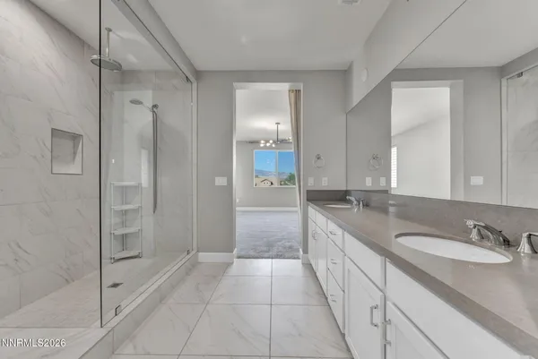 a bathroom with a shower and a bath tub