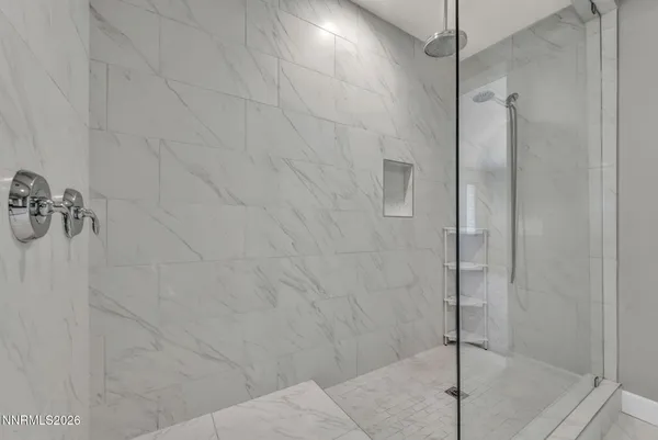 a bathroom with a shower and a shower