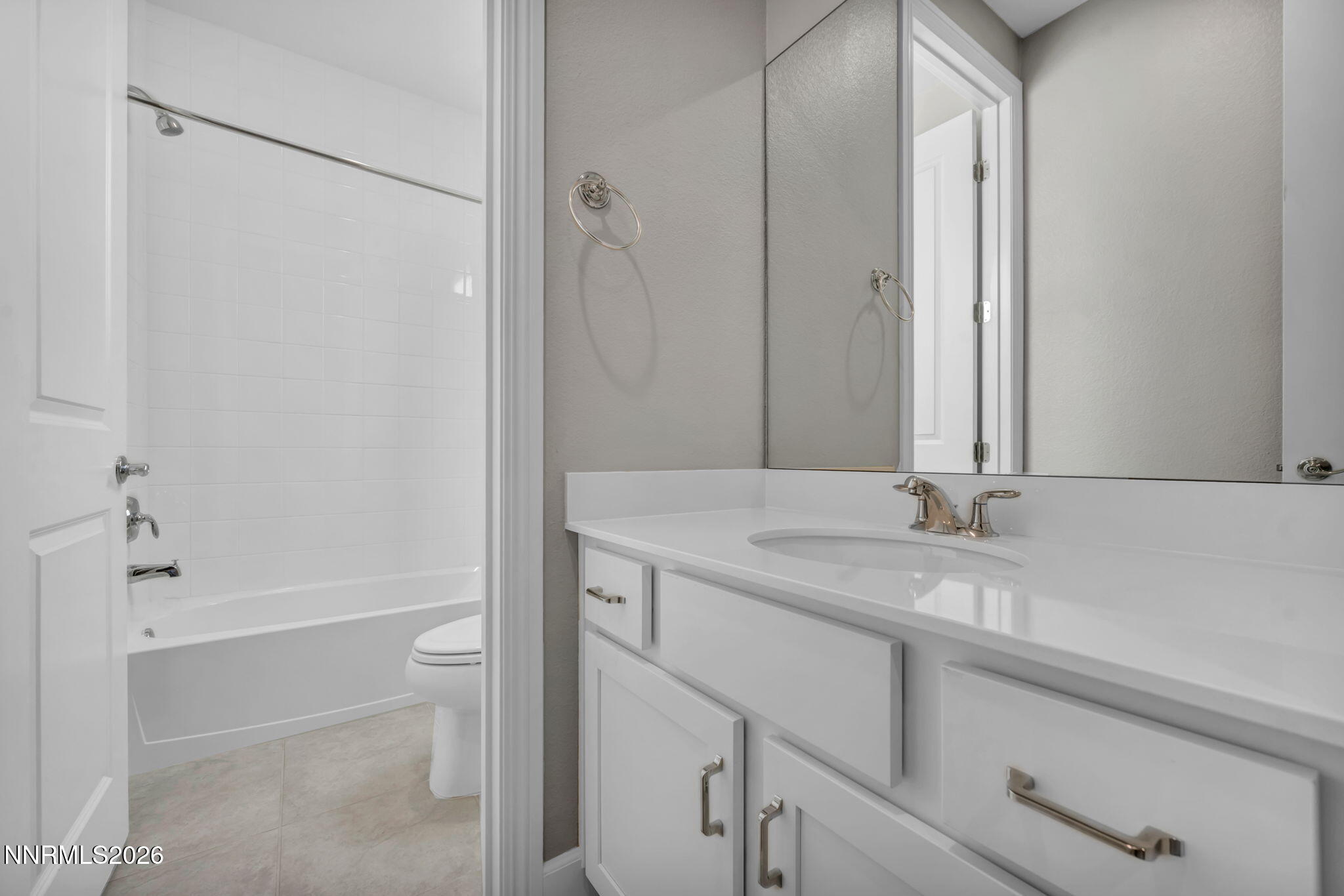 9267 Blue Basin Trail Reno, NV 89521 - Photo 51 of 95 a bathroom with a granite countertop sink toilet and shower