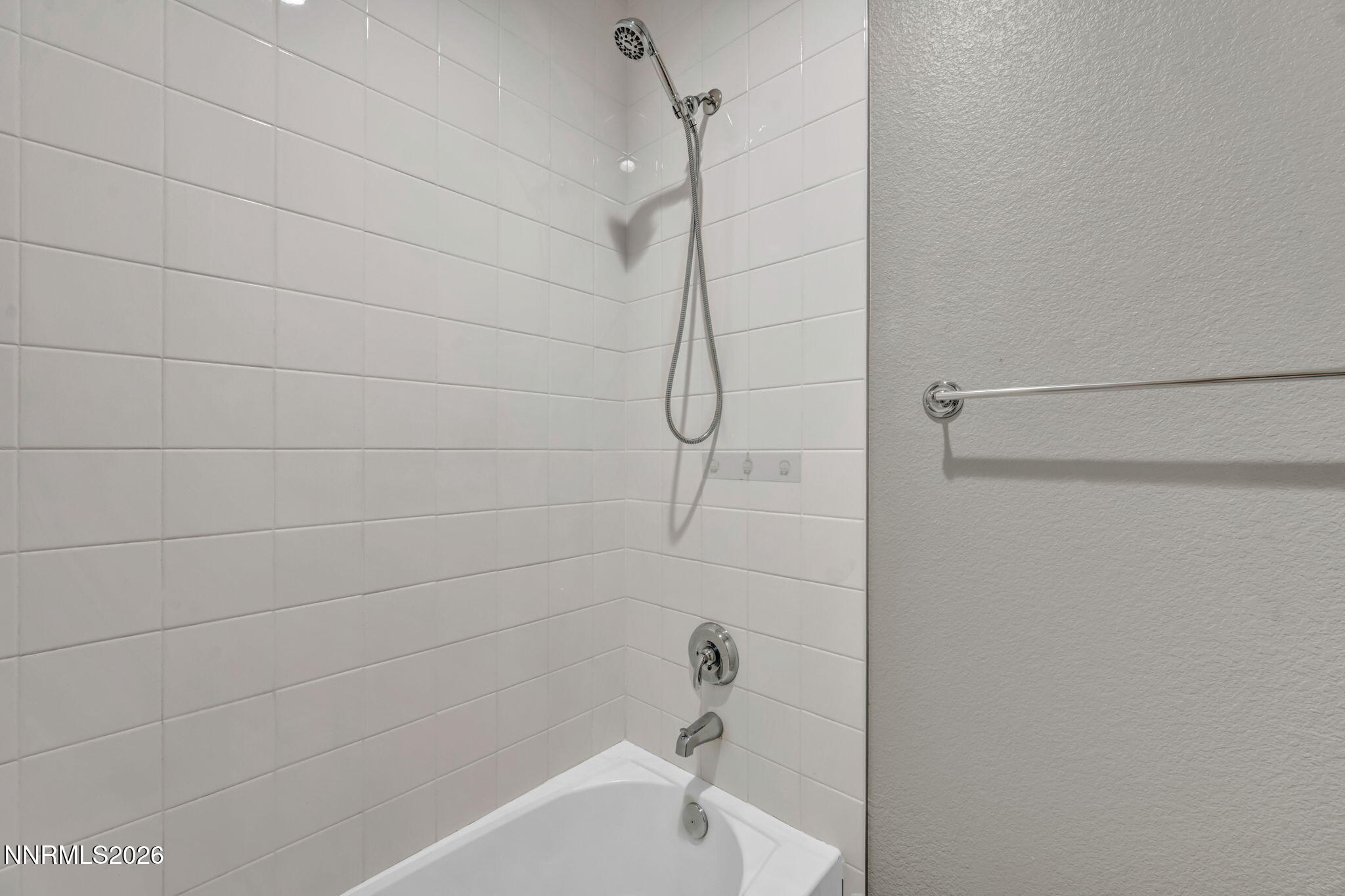 9267 Blue Basin Trail Reno, NV 89521 - Photo 60 of 95 a bathroom with a shower and a bath tub