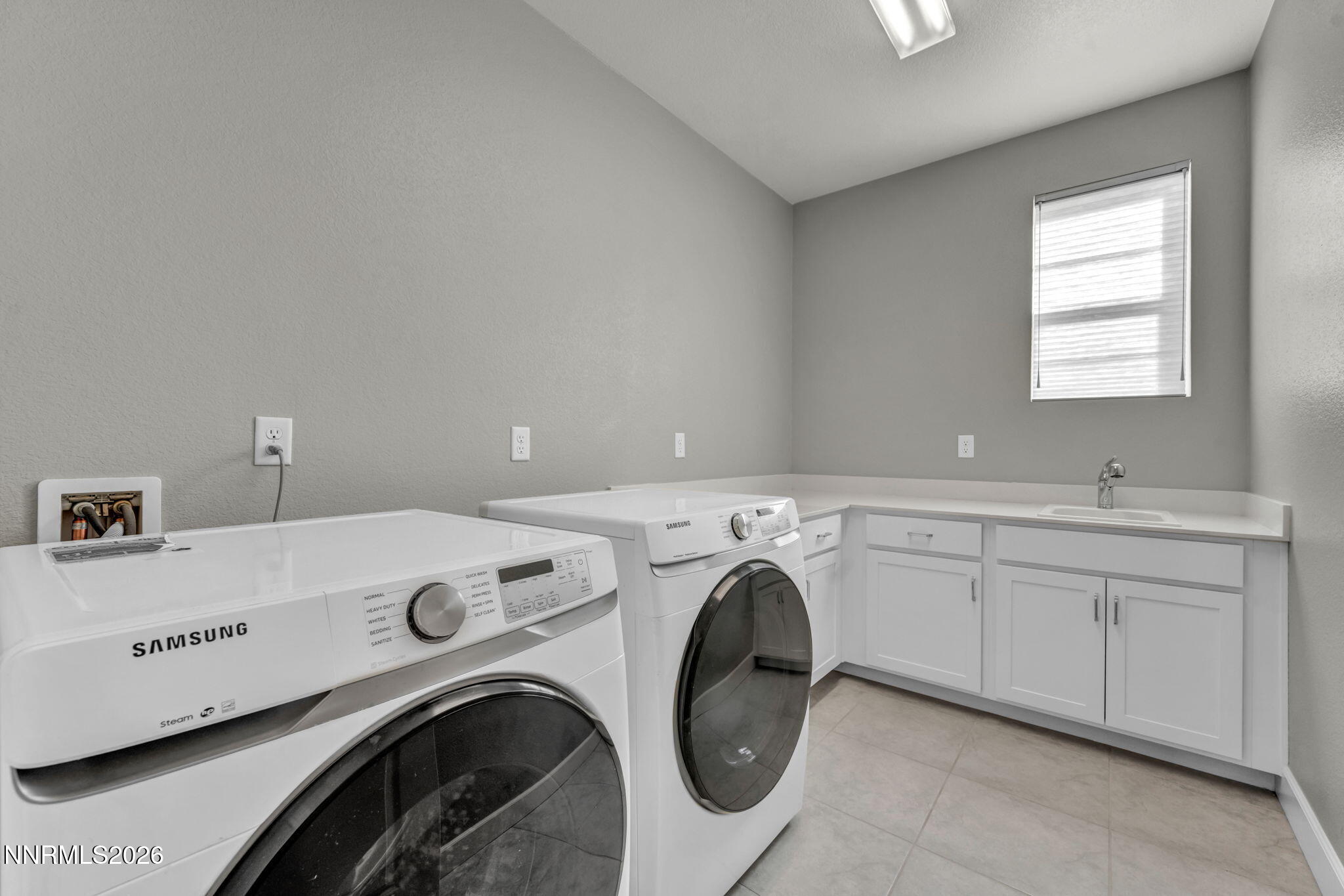 9267 Blue Basin Trail Reno, NV 89521 - Photo 62 of 95 a utility room with dryer and washer