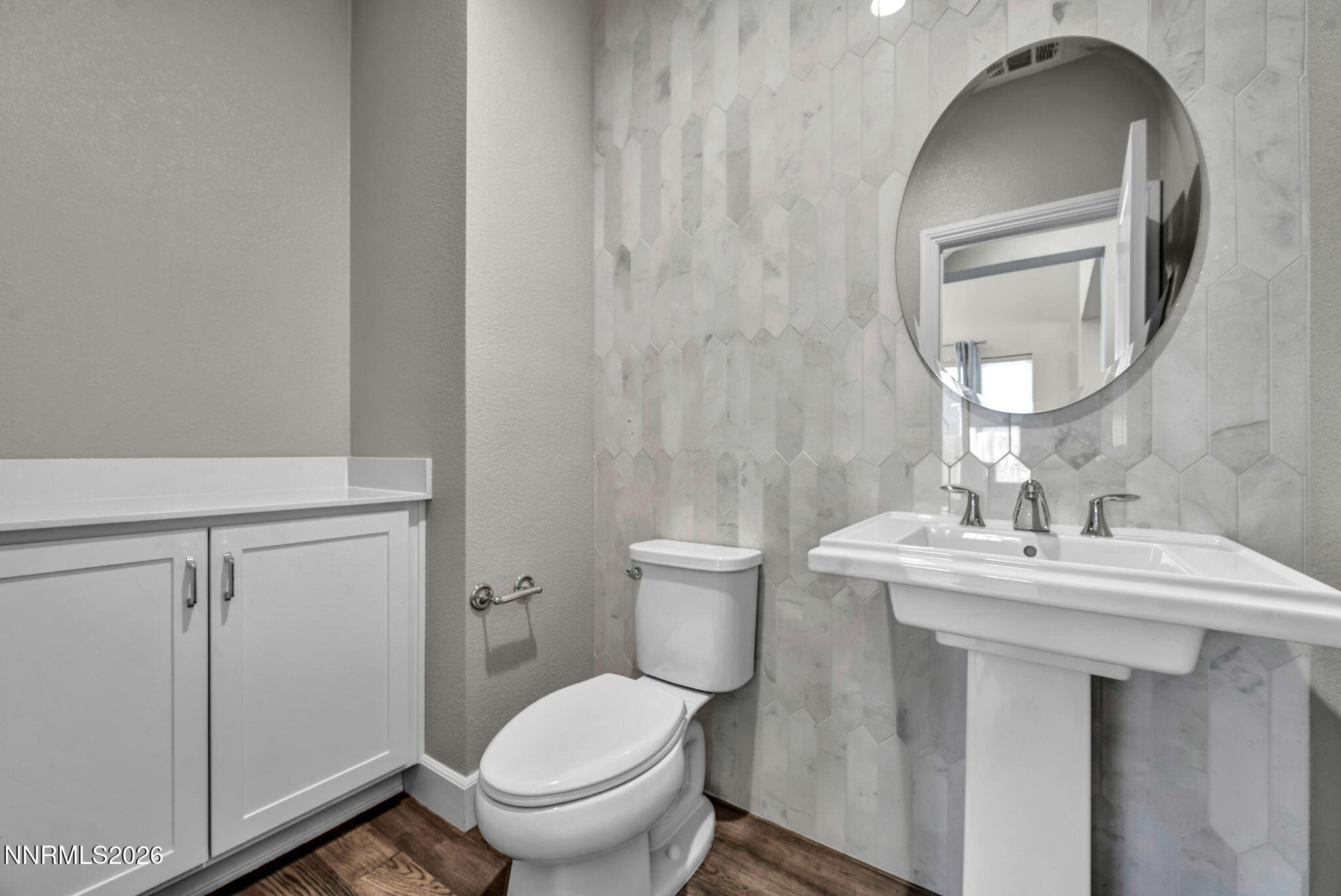 9267 Blue Basin Trail Reno, NV 89521 - Photo 63 of 95 a bathroom with a toilet sink and mirror