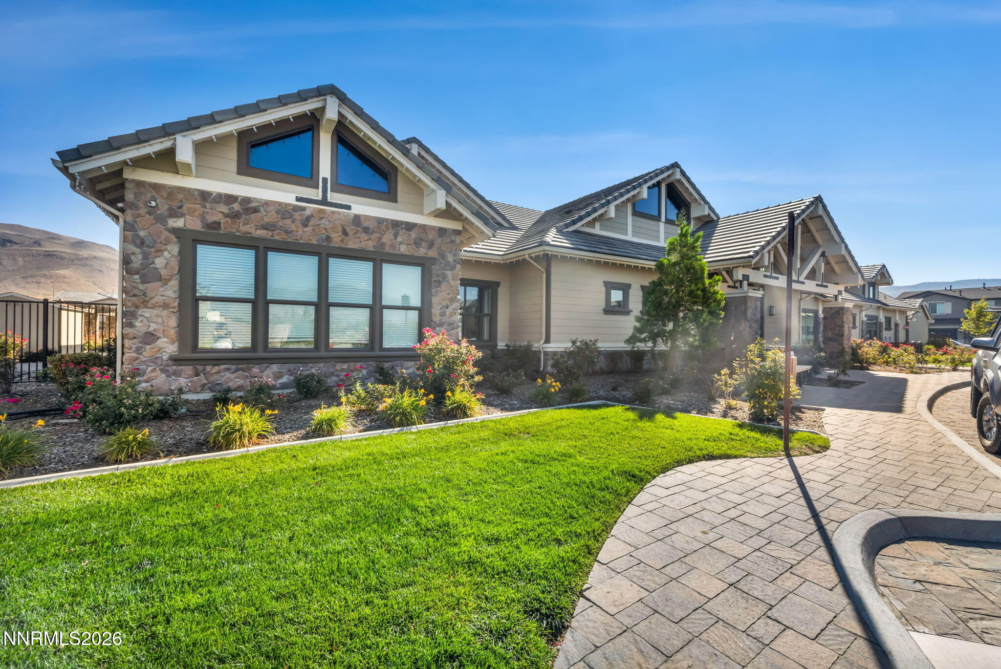 9267 Blue Basin Trail Reno, NV 89521 - Photo 80 of 95 a front view of a house with a yard table and chairs