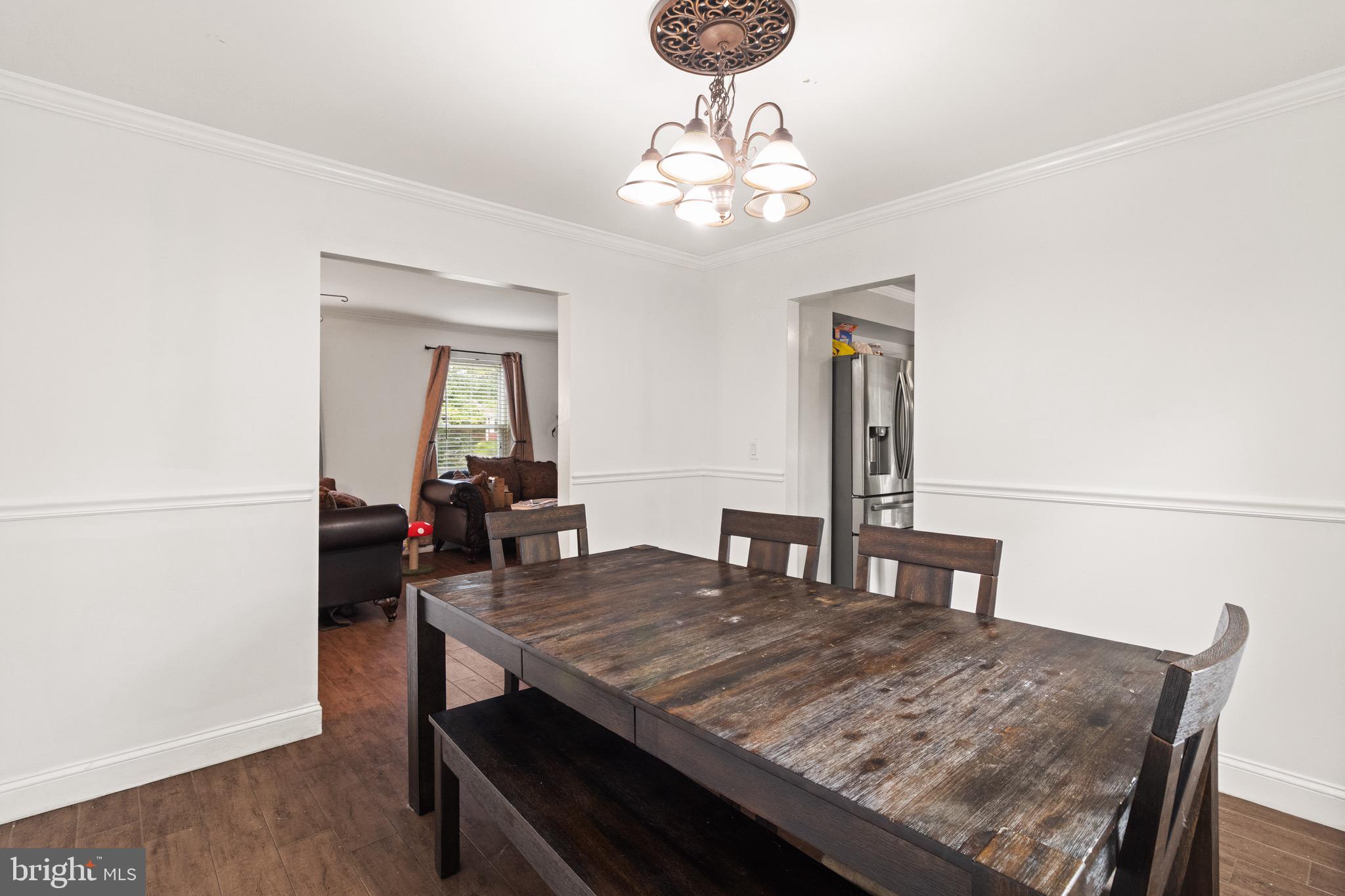 244 Raintree Boulevard Stafford, VA 22556 - Photo 11 of 34 a view of a dining room with furniture and wooden floor