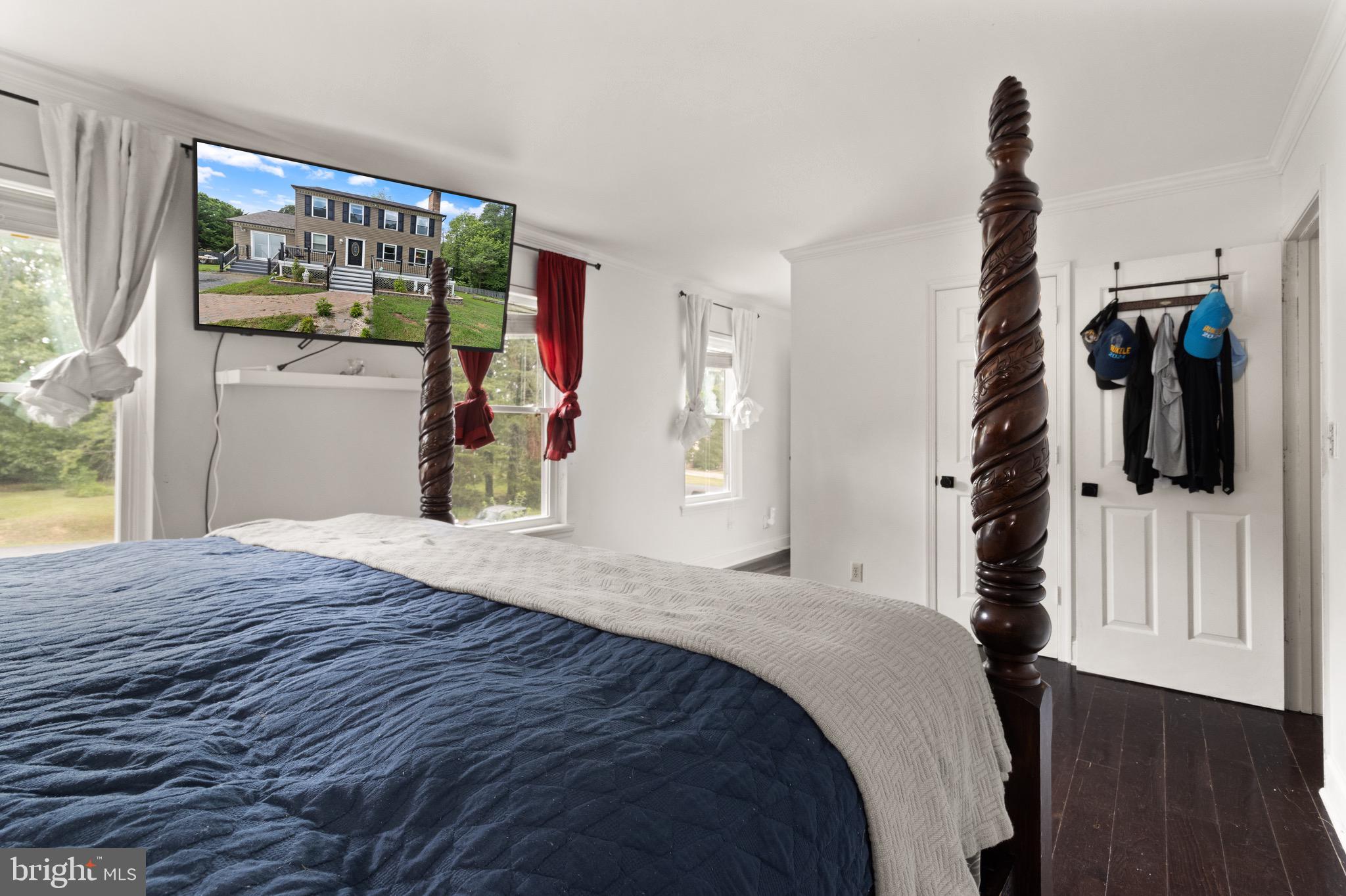 244 Raintree Boulevard Stafford, VA 22556 - Photo 15 of 34 a bedroom with a bed and a flat tv screen on dresser